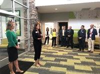 Local Chamber of Commerce attends the office's grand opening.